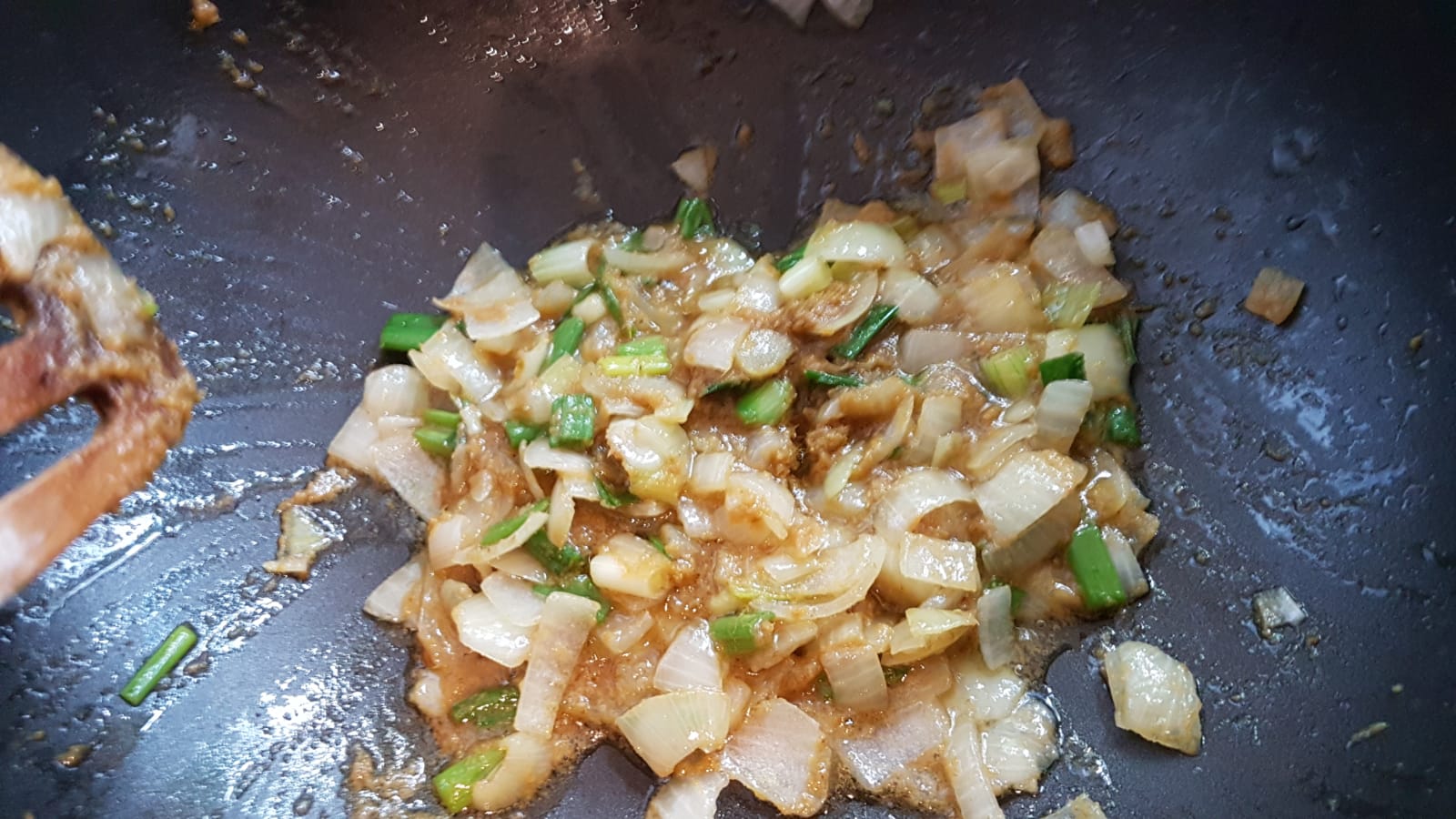 Fry the onions, spring onions and the curry