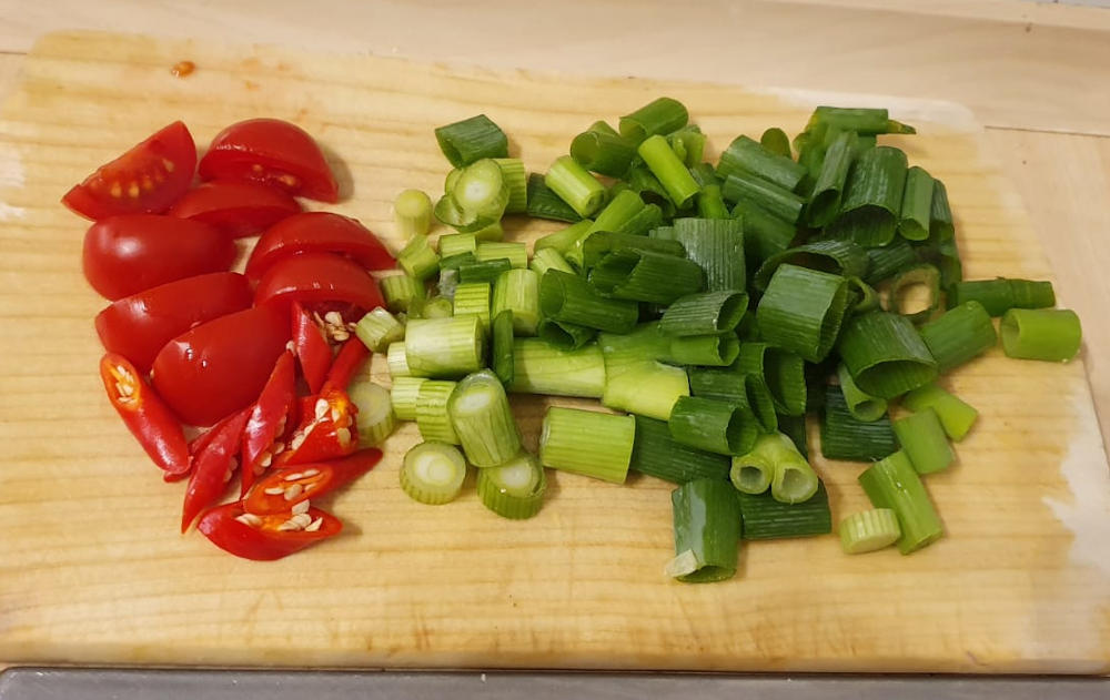 Tomato, chili peppers and spring onion