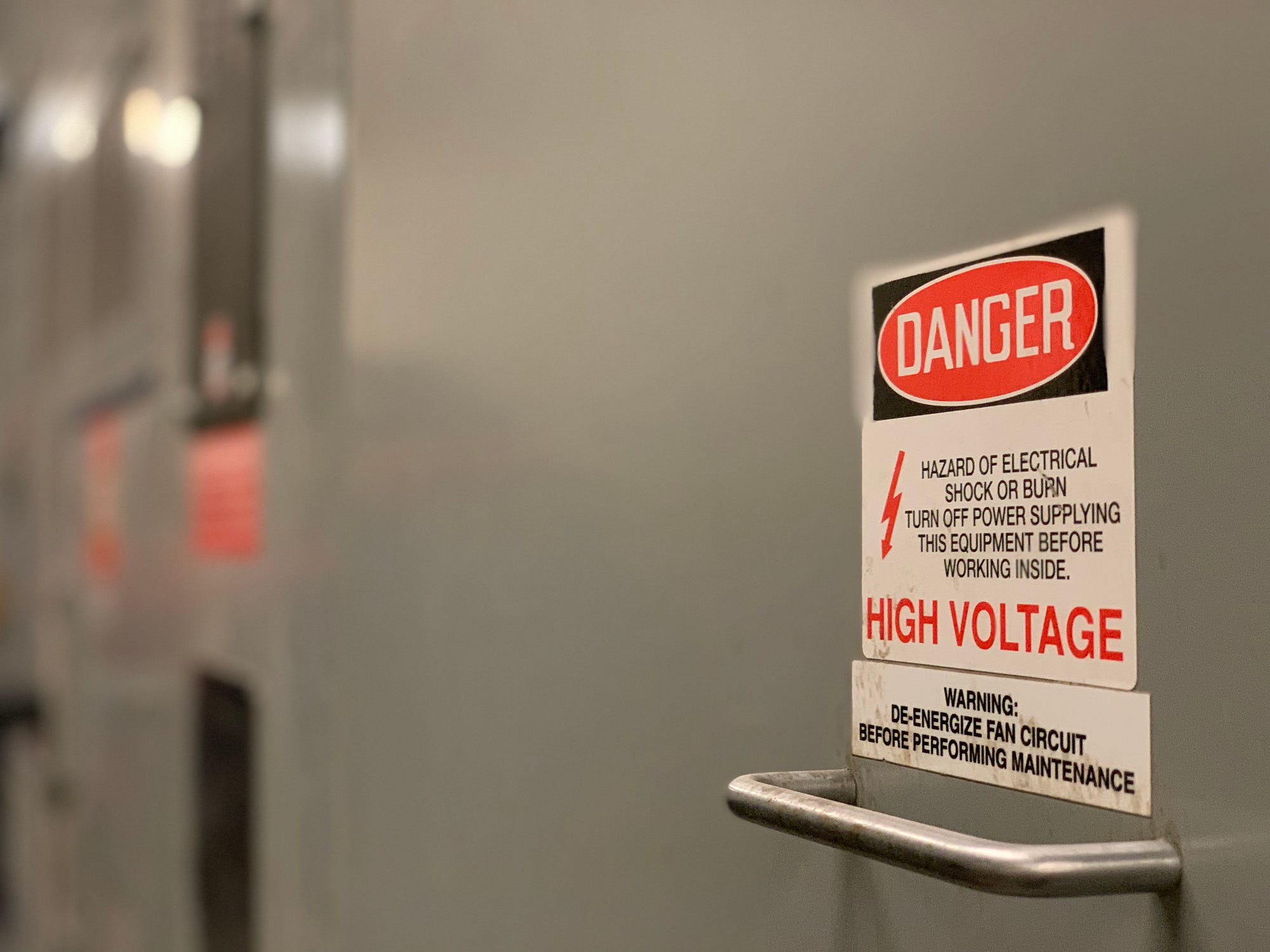 Be safe by looking at warning signs. Photo by Troy Bridges on Unsplash